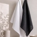 Black Cloth Napkins — folded at a place setting