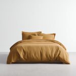 Cotton Sateen Bed Sheets — styled on a neatly made bed