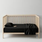 Crib Bed Sheets — styled on a neatly made bed