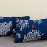 Embroidered Throw Pillows — on a sofa