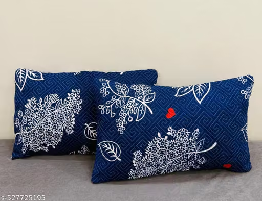 Embroidered Throw Pillows — on a sofa