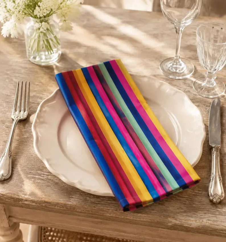 Graduation napkins navy cream folded 20x20 yarn-dyed cotton on buffet table with cake