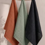 Green Napkins — folded at a place setting