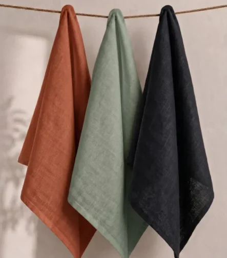 Green Napkins — folded at a place setting