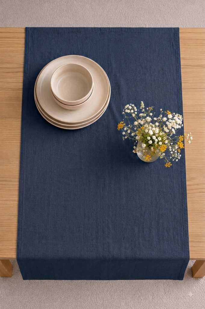 Navy linen table runner deep blue washed flax down an oak dining table