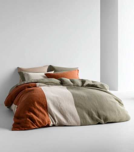 Olympic Queen Bed Sheets — styled on a neatly made bed