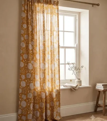 Pinch Pleat Sheer Curtains — hung at a window