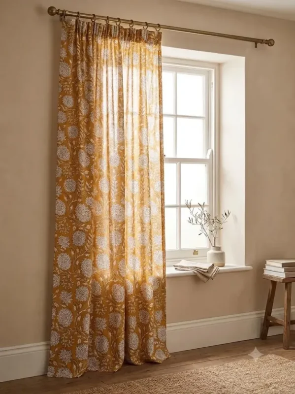 Pinch Pleat Sheer Curtains — hung at a window