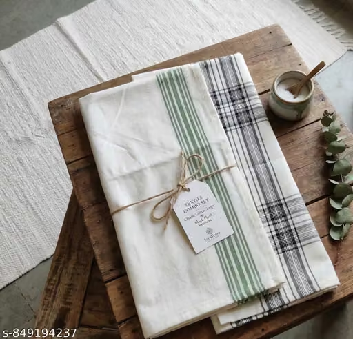 Plaid table runner red green tartan yarn-dyed cotton on rustic Christmas dining table
