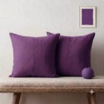 Purple Throw Pillows — on a sofa