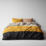 Reversible Quilt — folded on a bed