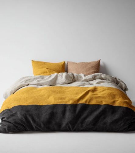 Reversible Quilt — folded on a bed