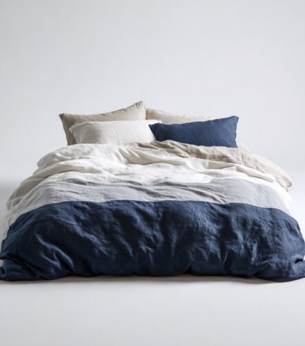 White Bedspread — draped over a bed
